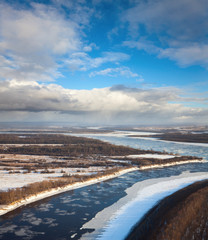 Great river with floating ice floes
