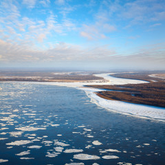 great river with floating ice floes