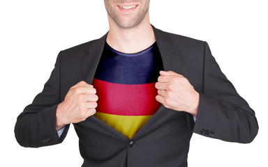 Businessman opening suit to reveal shirt with flag