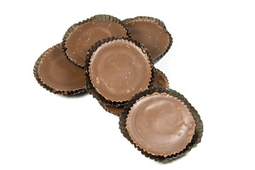 Six Brown Circular Chocolates in Protective Papers