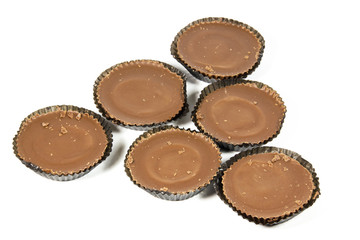 Six Brown Chocolates in Dark Protective Papers