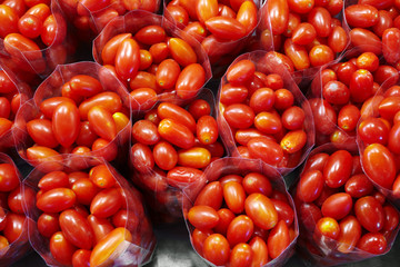 close up many cherry tomato in plastic bag