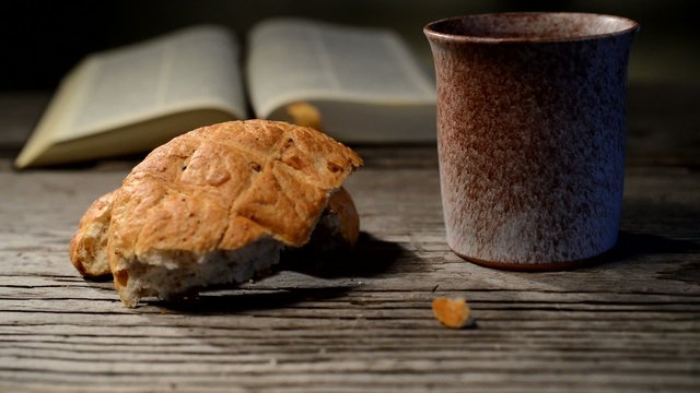 bible with chalice and bread, panning,sliding, tilt