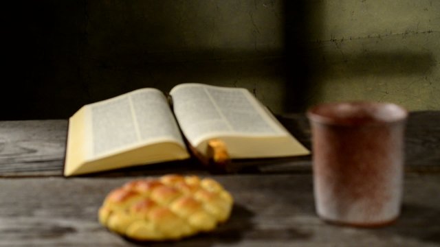 bible with chalice and bread,rack focus