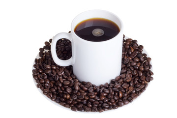 Coffee beans with a cup of coffee