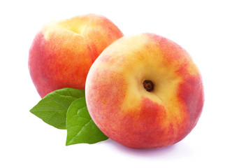 Ripe peach with leaf