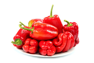 Fresh red peppers on a plate.