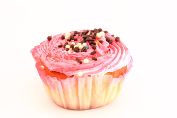 Pink and creamy cupcake decorated with chocolate pearls.