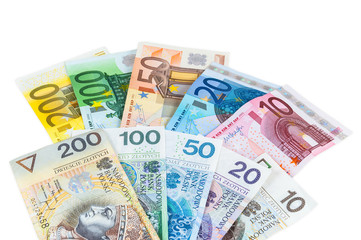 Obraz na płótnie Canvas Euro and new polish zloty banknotes