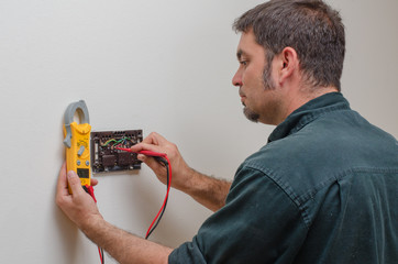Technician working on a thermostat