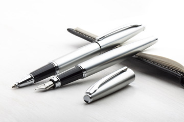 Silver fountain pen and roller pen