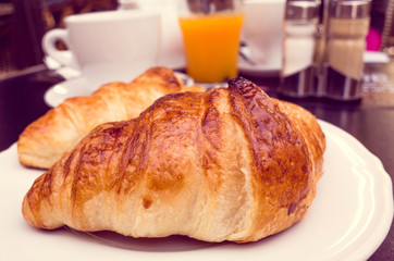 coffee and croissants on table