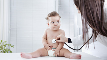 Pediatrician doing checkup on baby