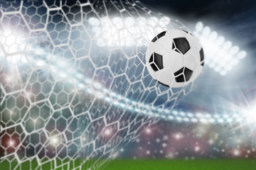 Fototapeta premium soccer ball in goal net