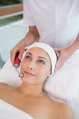 Peaceful brunette getting micro dermabrasion