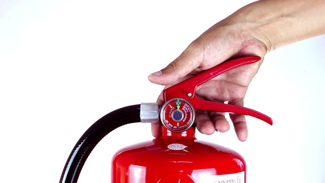 A man grabs a fire extinguisher over white background