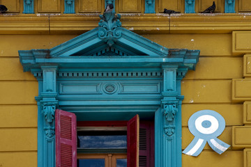 old blue yellow little terrace red venetian blind and roof