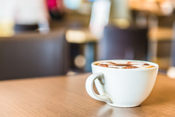 Coffee cup in coffee shop interior