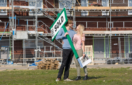 Young couple on construction site