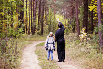 father and daughter in forest