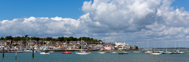 Fototapeta na wymiar Cowes harbour Isle of Wight on a calm blue sky summer day