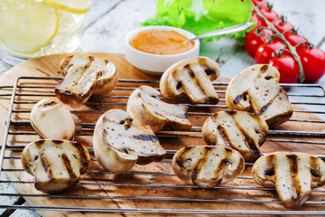 Grilled mushrooms with sauce on the grill