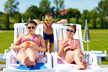 group of teenage kids enjoying summer in water park