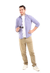 Stylish man wearing sunglasses, standing over white background. 