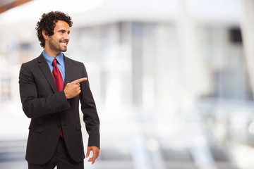 Businessman pointing his finger to the copy-space