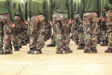 Soldiers in camouflage military uniform in rest position