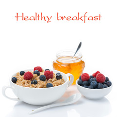 healthy breakfast, oat porridge with berries and honey, isolated