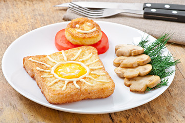 Jolly egg sandwich decorated with mushrooms and tomatoes