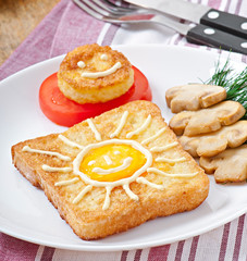 Jolly egg sandwich decorated with mushrooms and tomatoes