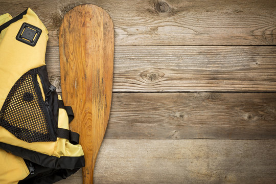 Canoe Paddle And Life Jacket