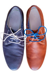 Pair of men's leather shoes. Each in different color