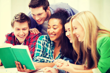 students reading book at school