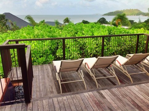 resting chairs inwooden decking terrace