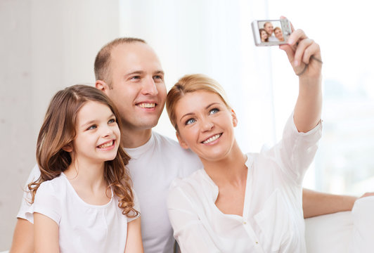 Happy Family With Little Girl Making Self Portrait