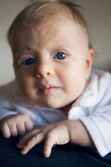 Blond newborn baby with blue eyes