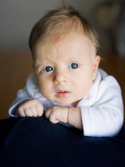 Blond newborn baby with blue eyes