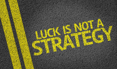 Luck Is Not a Strategy written on the road