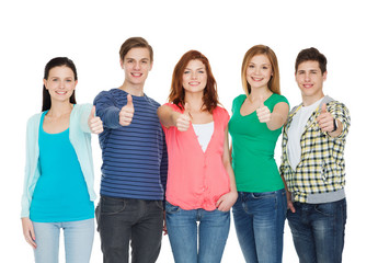 Obraz premium group of smiling students showing thumbs up