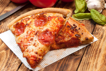 Two pieces of pizza. © Arkadiusz Fajer