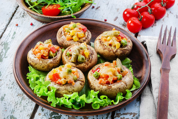 Baked mushrooms with cheese and vegetables