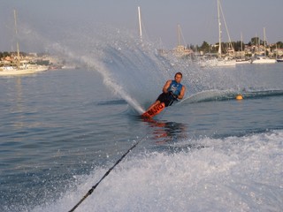 man waterskiing slalom on sea in greece