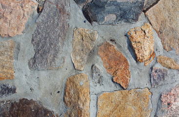 Colored stones on a grey background