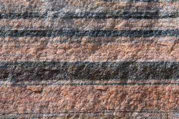 Red granite with gray stripes, closeup