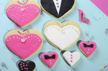 Wedding party bride and groom pink & white cookies on blue tray