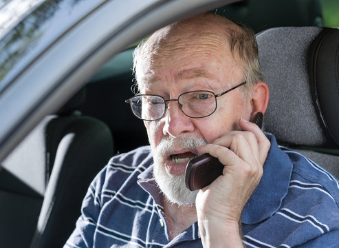 Angry Old Man Yelling on Cell Phone in Car