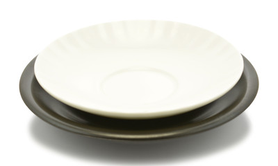 black and white empty plate over a white background